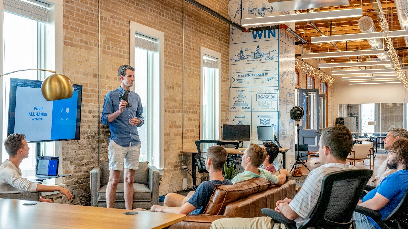 A project manager leading a team meeting